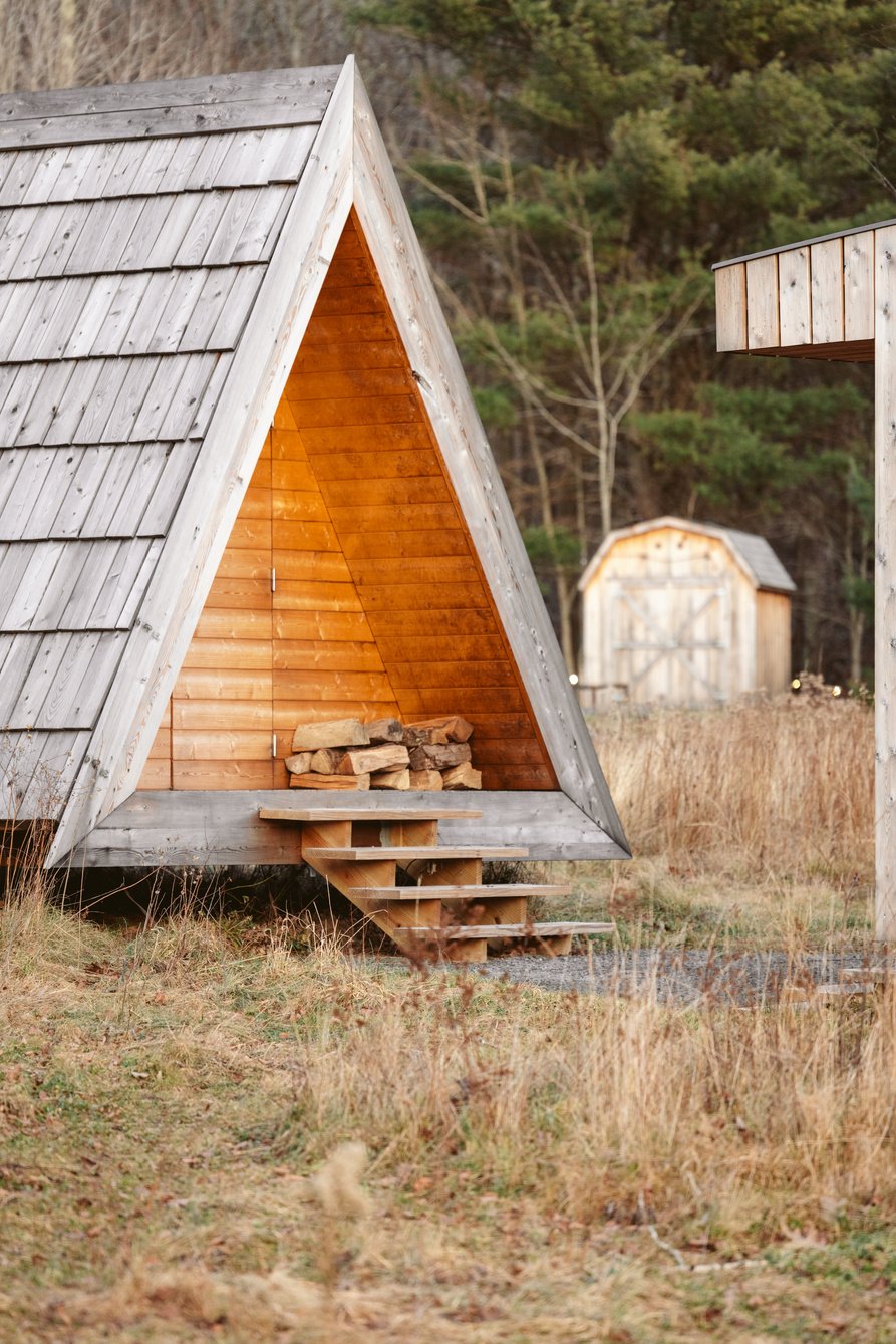 Brown Wooden House on Brown Grass Field