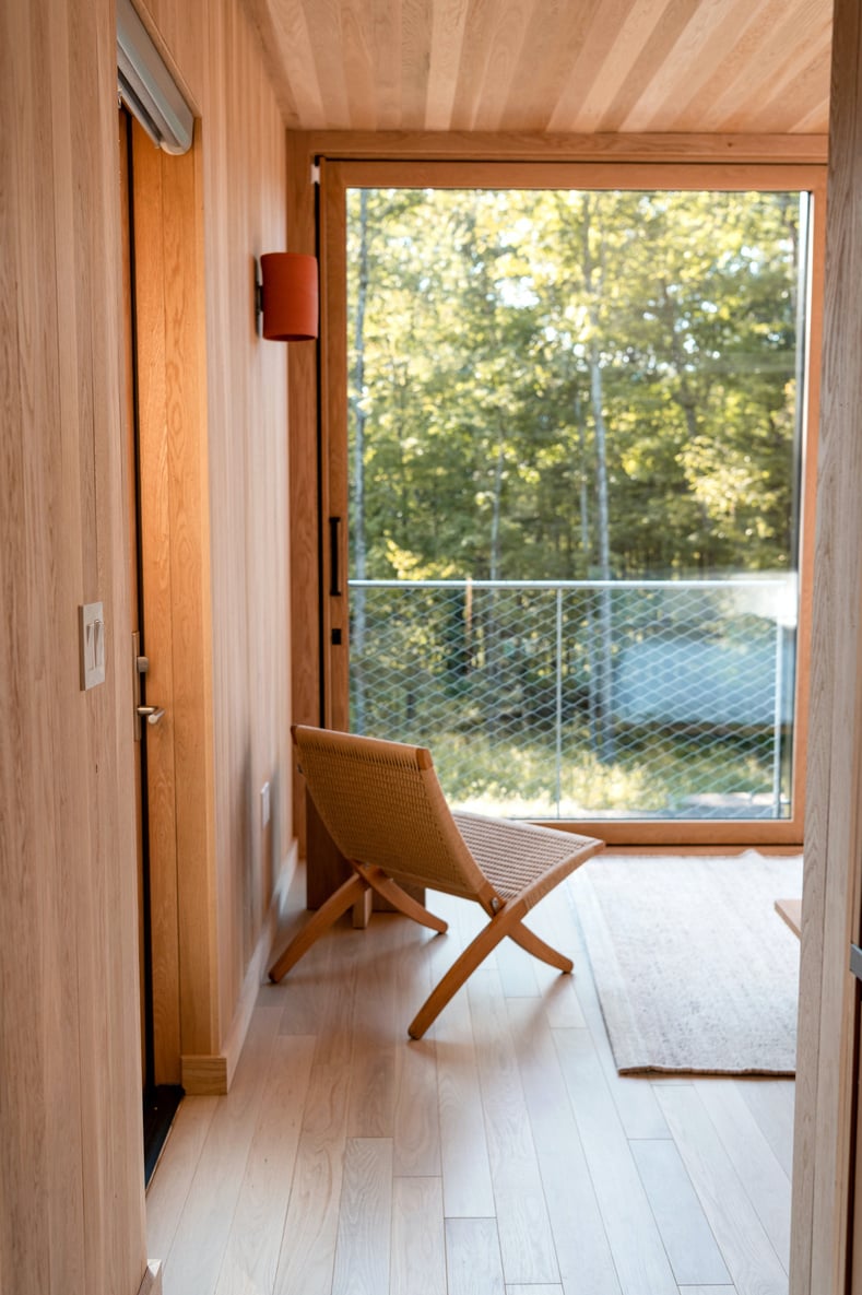 Brown Wooden Chair Near Glass Door